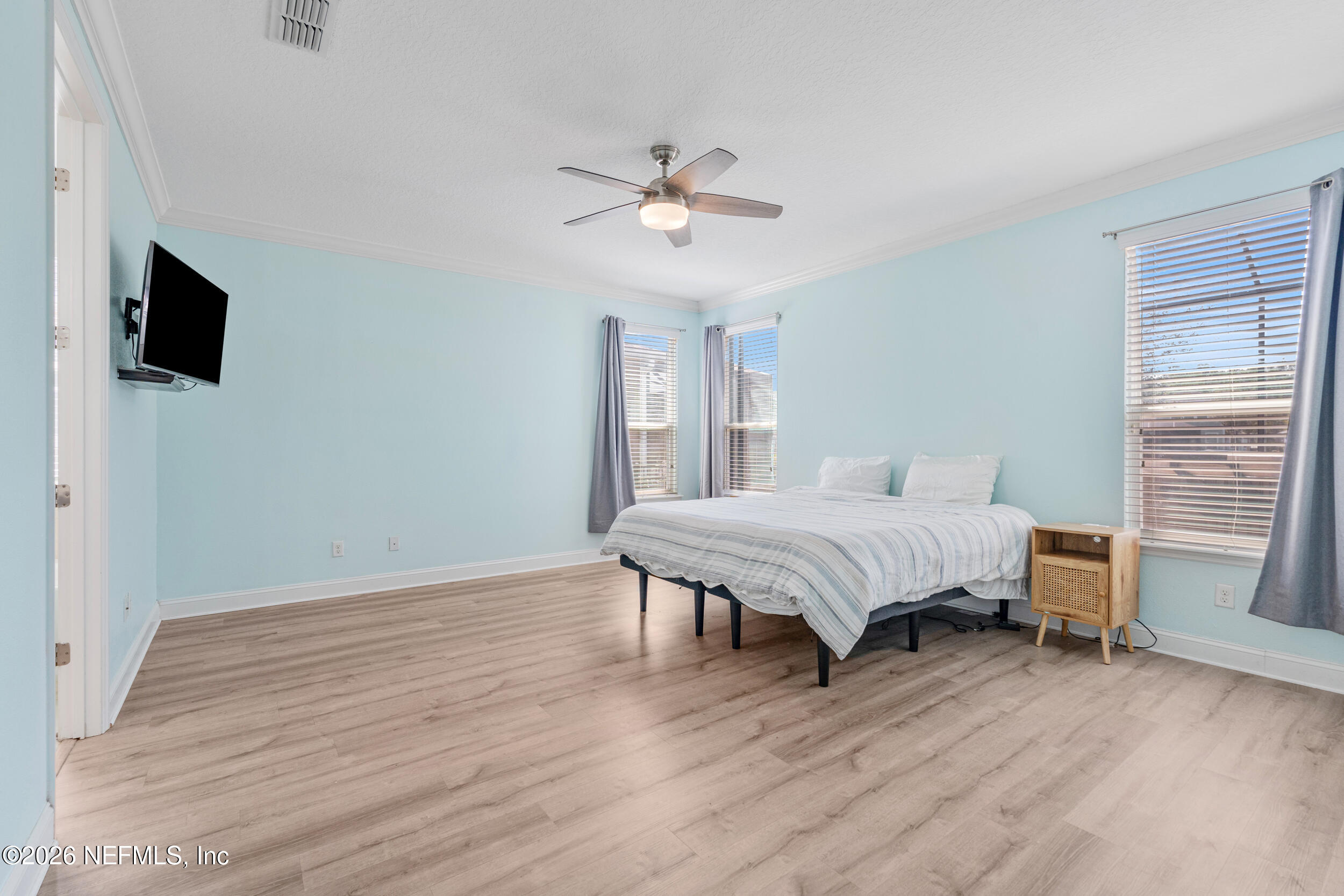168 St Kitts Loop St. Augustine, FL 32092 - Photo 23 of 47 a spacious bedroom with a bed and a window
