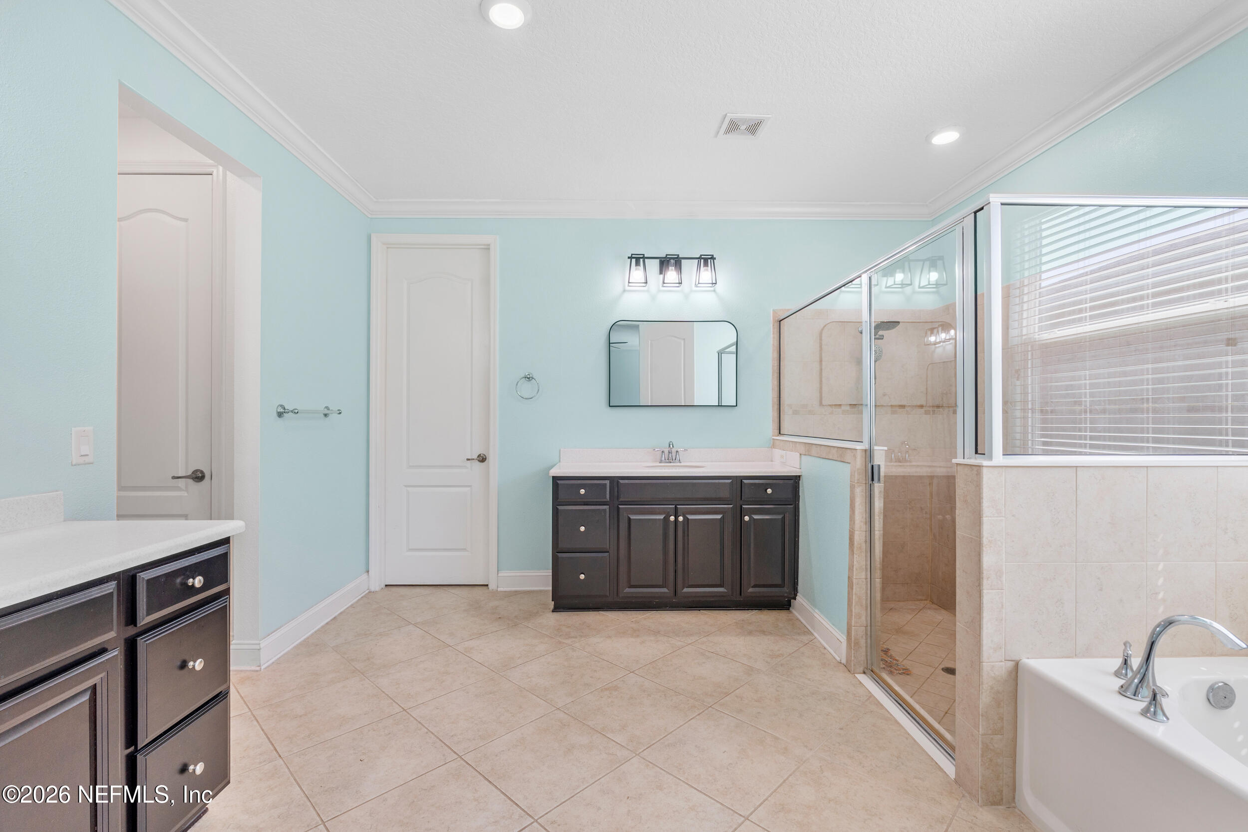 168 St Kitts Loop St. Augustine, FL 32092 - Photo 25 of 47 a spacious bathroom with a tub sink and mirror