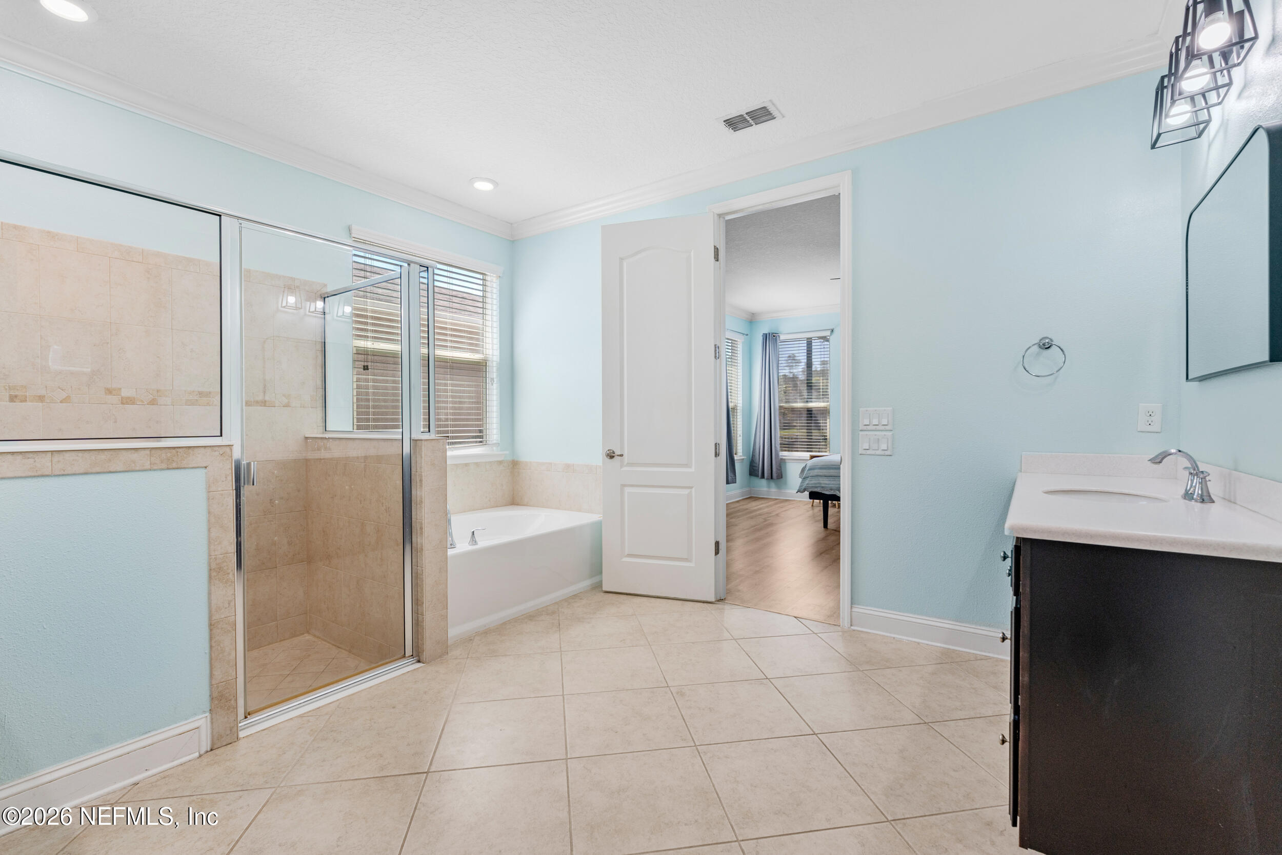 168 St Kitts Loop St. Augustine, FL 32092 - Photo 26 of 47 a bathroom with a bathtub shower sink and mirror