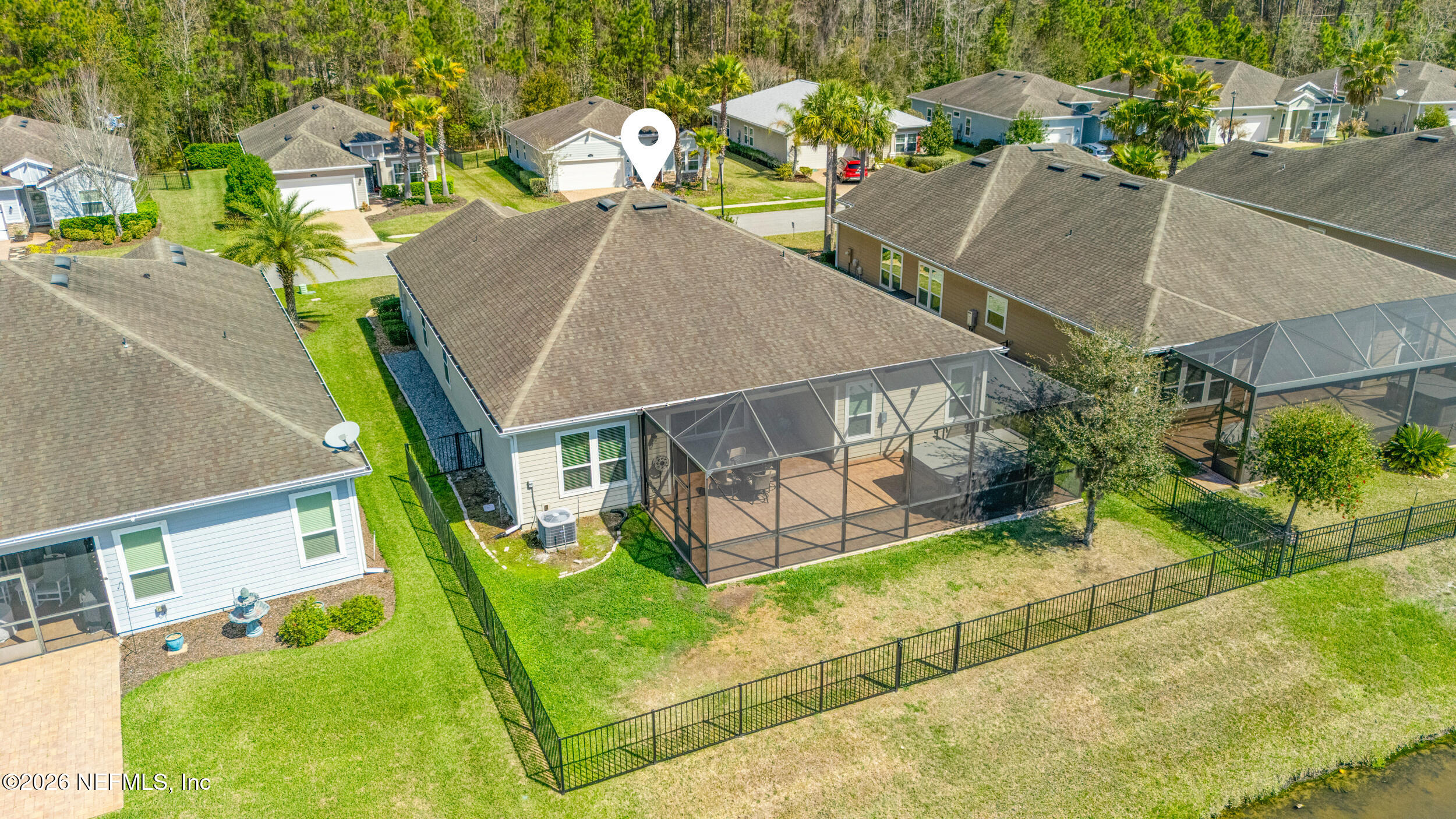 168 St Kitts Loop St. Augustine, FL 32092 - Photo 36 of 47 an aerial view of a house with a yard and potted plants