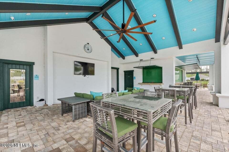 168 St Kitts Loop St. Augustine, FL 32092 - Photo 41 of 47 a view of a dinning table and chairs in the patio
