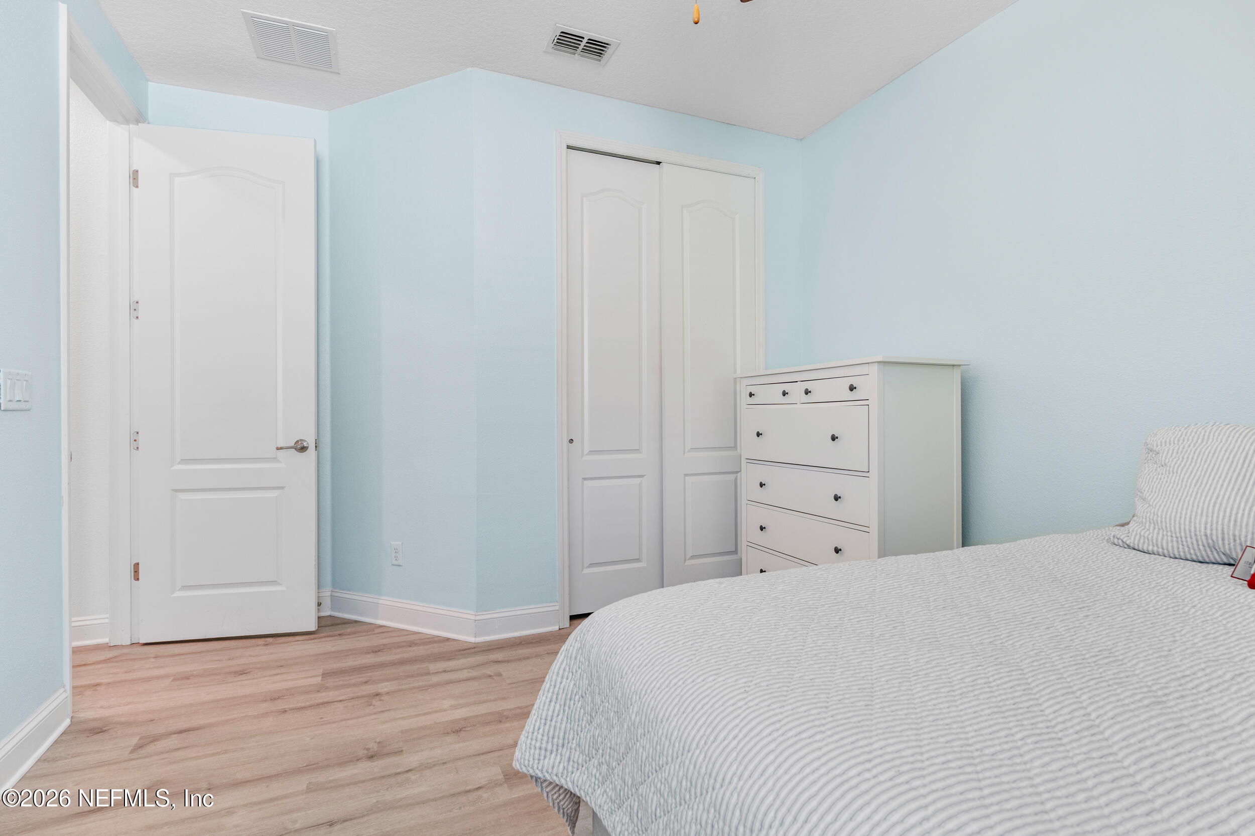 168 St Kitts Loop St. Augustine, FL 32092 - Photo 9 of 47 a large white bed in a white room