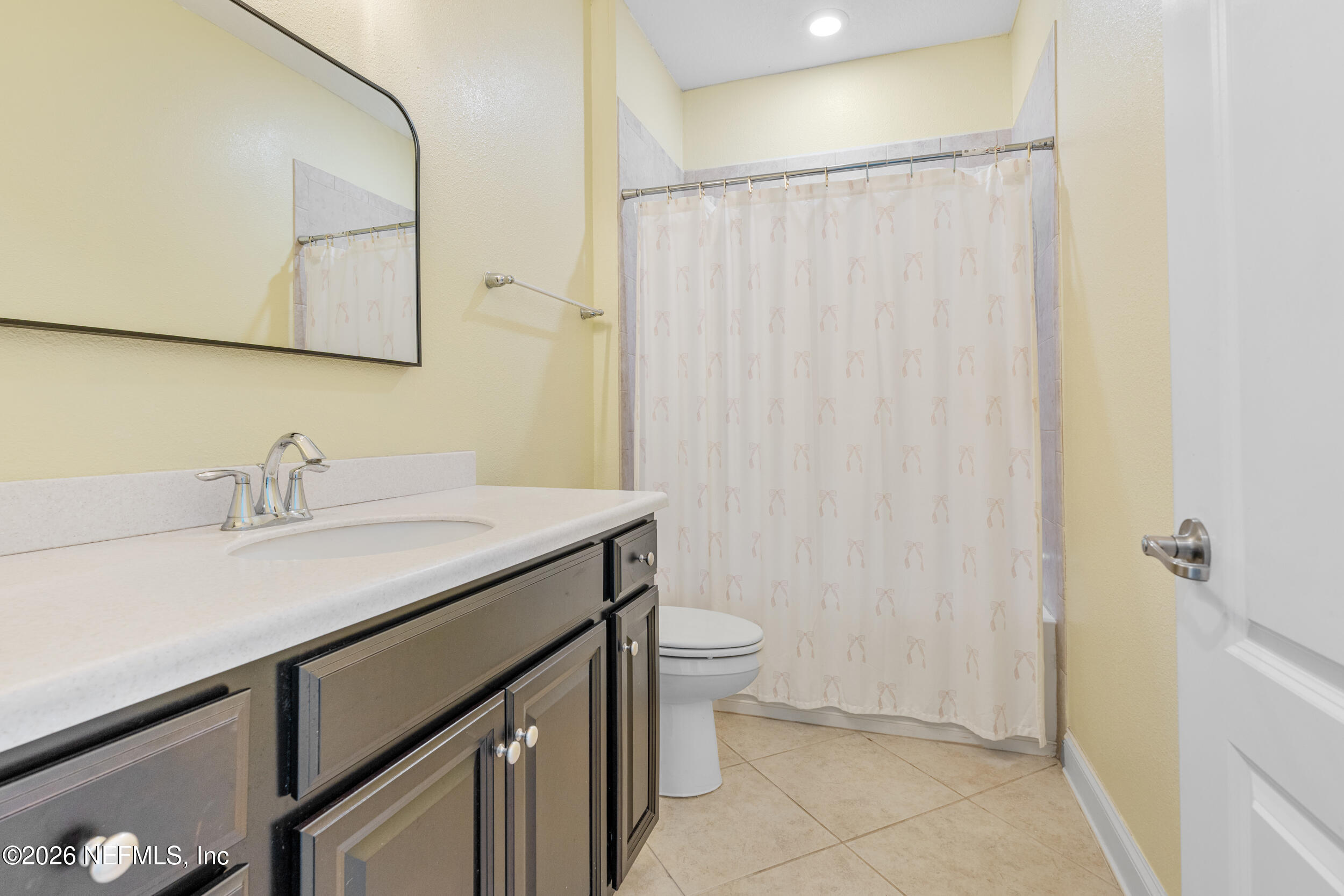 168 St Kitts Loop St. Augustine, FL 32092 - Photo 10 of 47 a bathroom with a granite countertop sink and a mirror