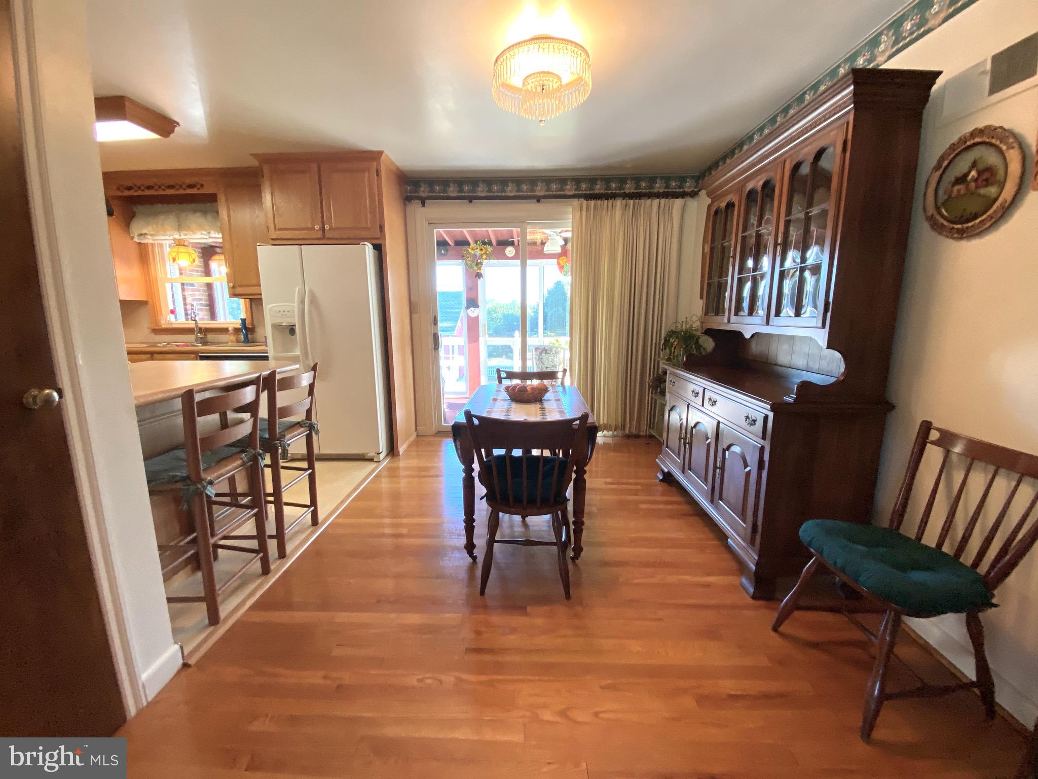 3738 Salem Road York, PA 17408 - Photo 6 of 27 DR with HW floor w/sliding door access to 3 season