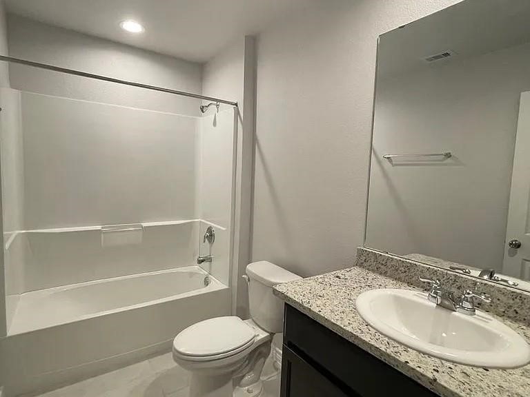 2317 Restful Lane Corpus Christi, TX 78418 - Photo 6 of 6 a bathroom with a granite countertop sink toilet and shower