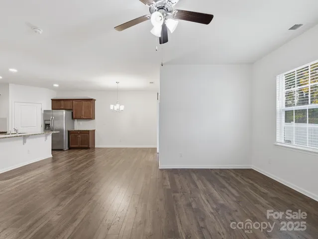 a view of kitchen with sink and wooden floor