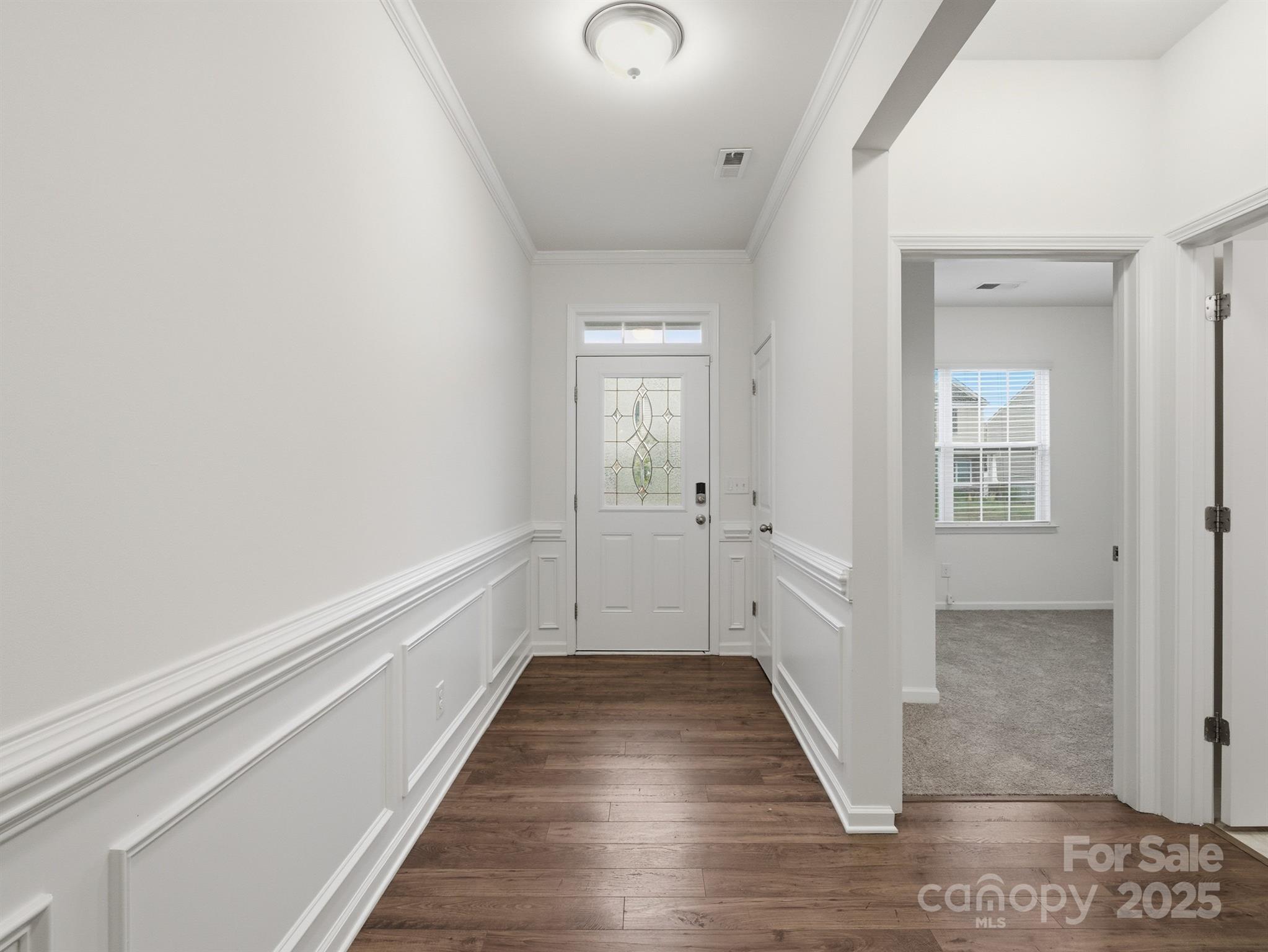 2212 Apple Glen Lane Charlotte, NC 28269 - Photo 13 of 32 a view of a hallway with wooden floor