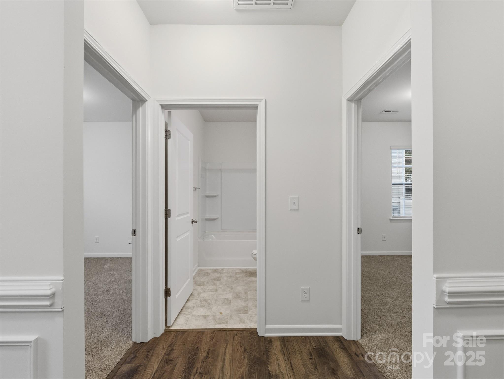 2212 Apple Glen Lane Charlotte, NC 28269 - Photo 15 of 32 an empty room with wooden floor