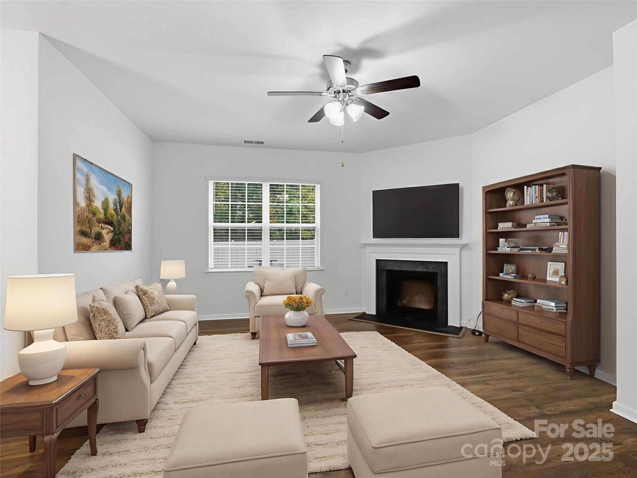 2212 Apple Glen Lane Charlotte, NC 28269 - Photo 2 of 32 a living room with furniture a fireplace and a flat screen tv