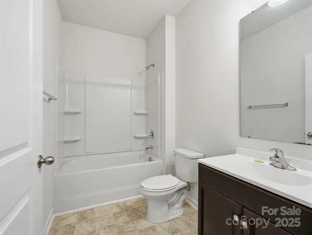 a bathroom with a toilet a sink and a bathtub