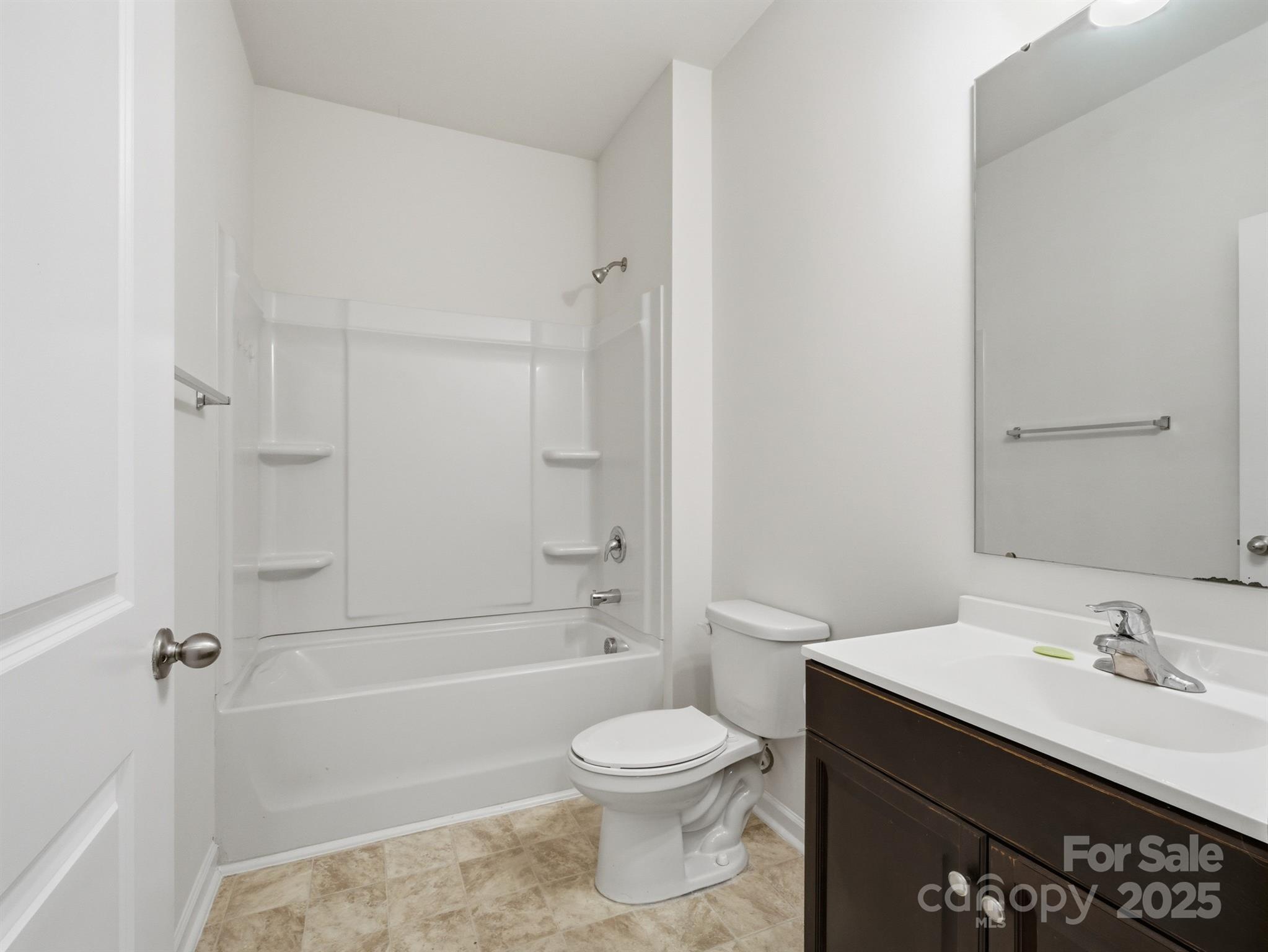 2212 Apple Glen Lane Charlotte, NC 28269 - Photo 22 of 32 a bathroom with a toilet a sink and a bathtub