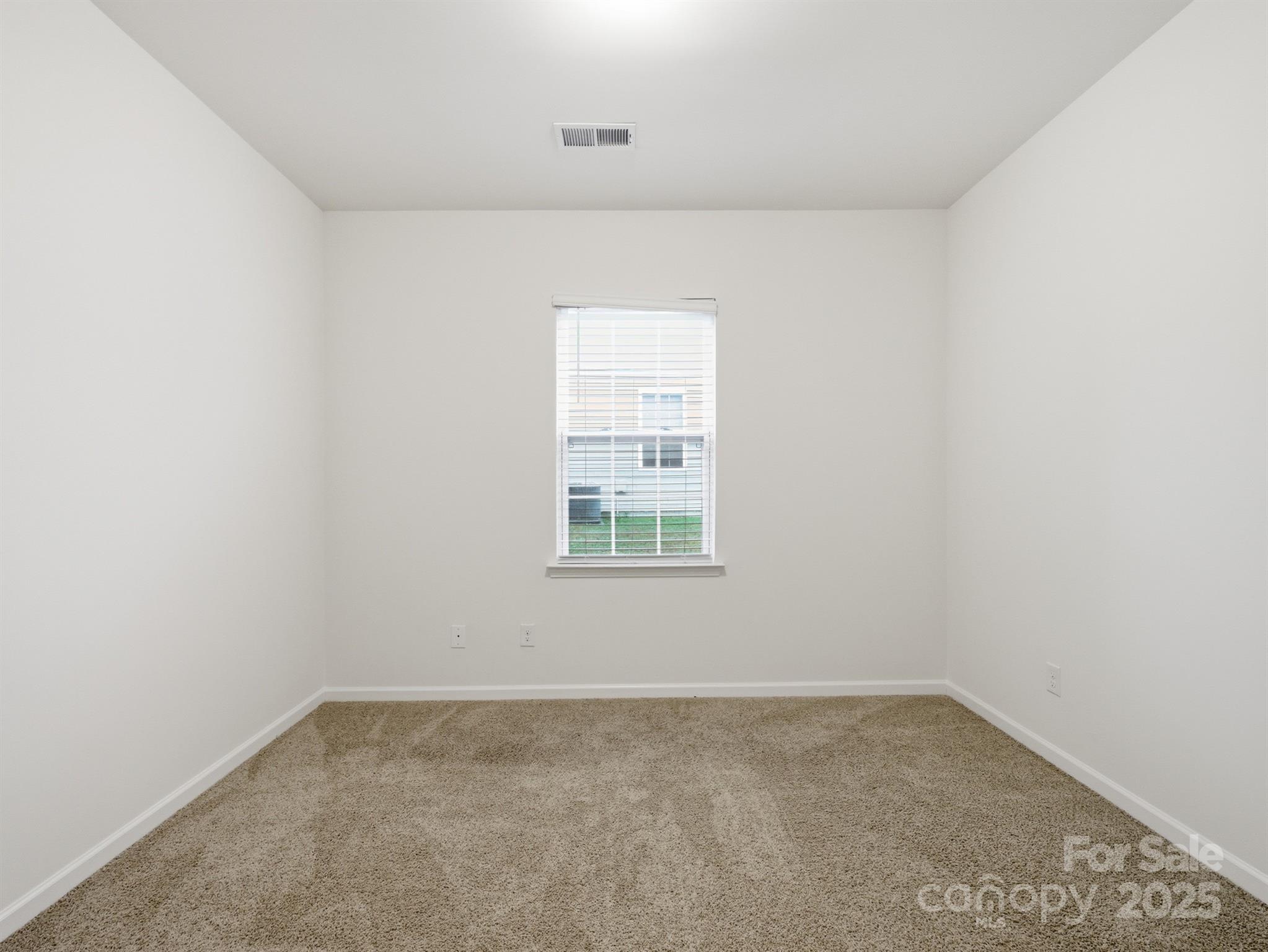 2212 Apple Glen Lane Charlotte, NC 28269 - Photo 23 of 32 an empty room with a window