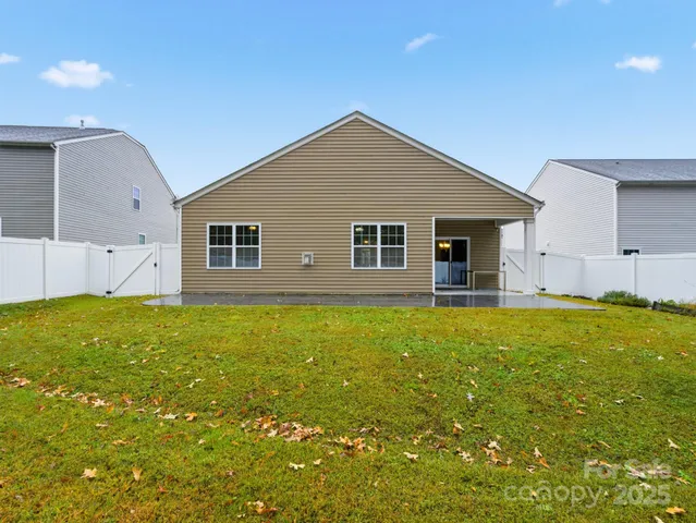 a front view of house with yard and seating area