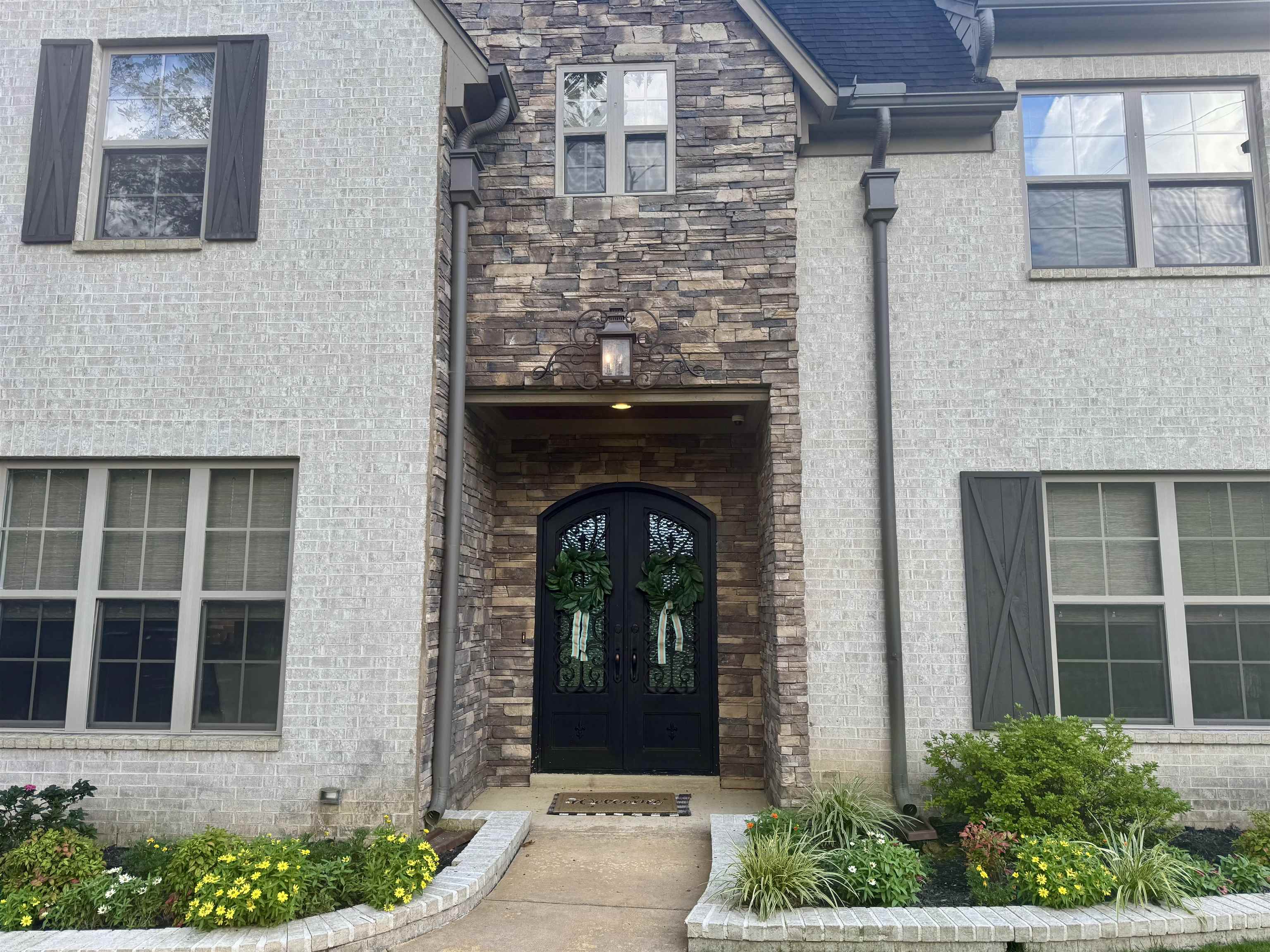 Double Iron doors and stone entry