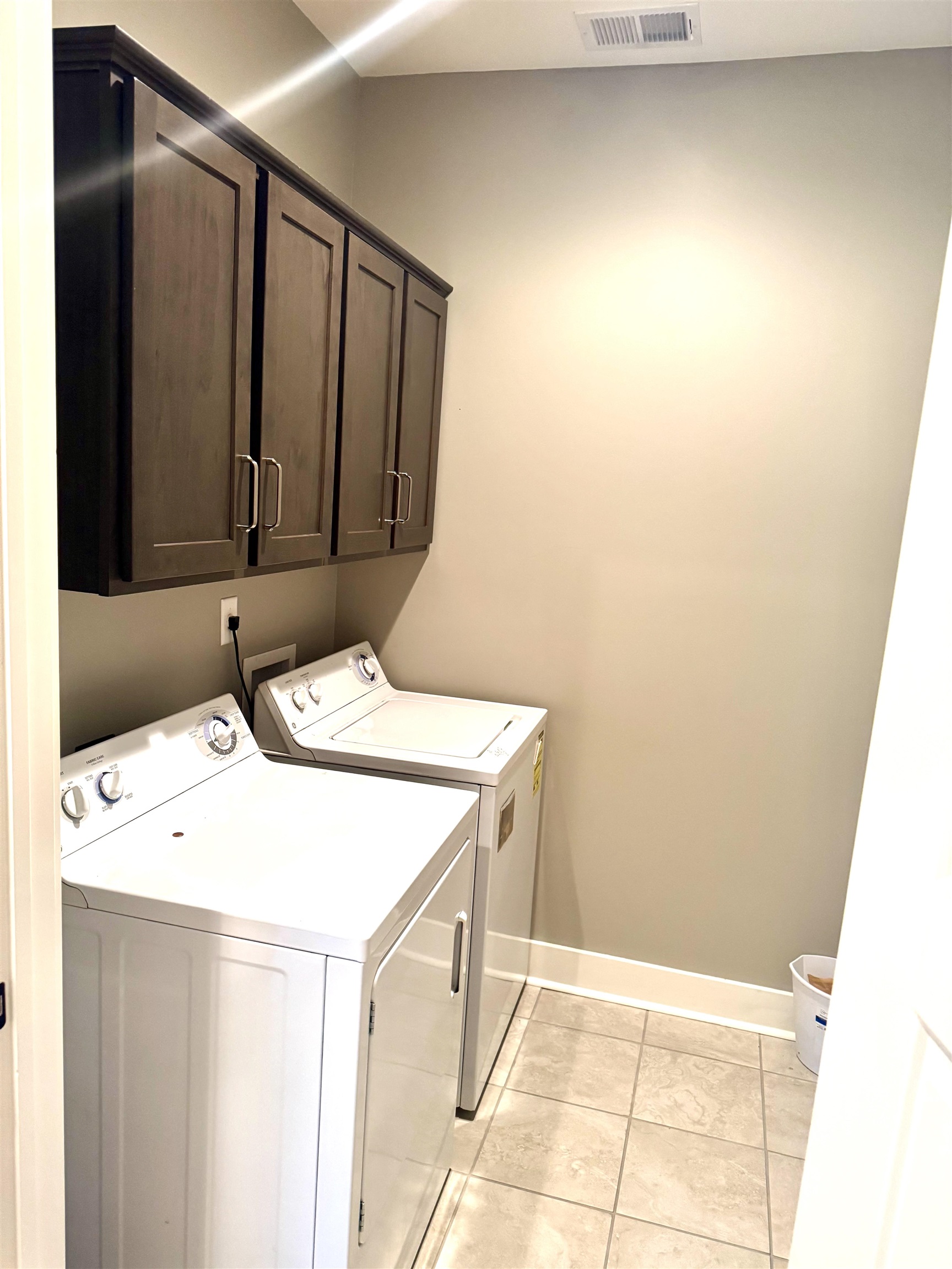 10879 Latting Road Eads, TN 38028 - Photo 24 of 40 2nd Laundry room upstairs with cabinets W/D Stay