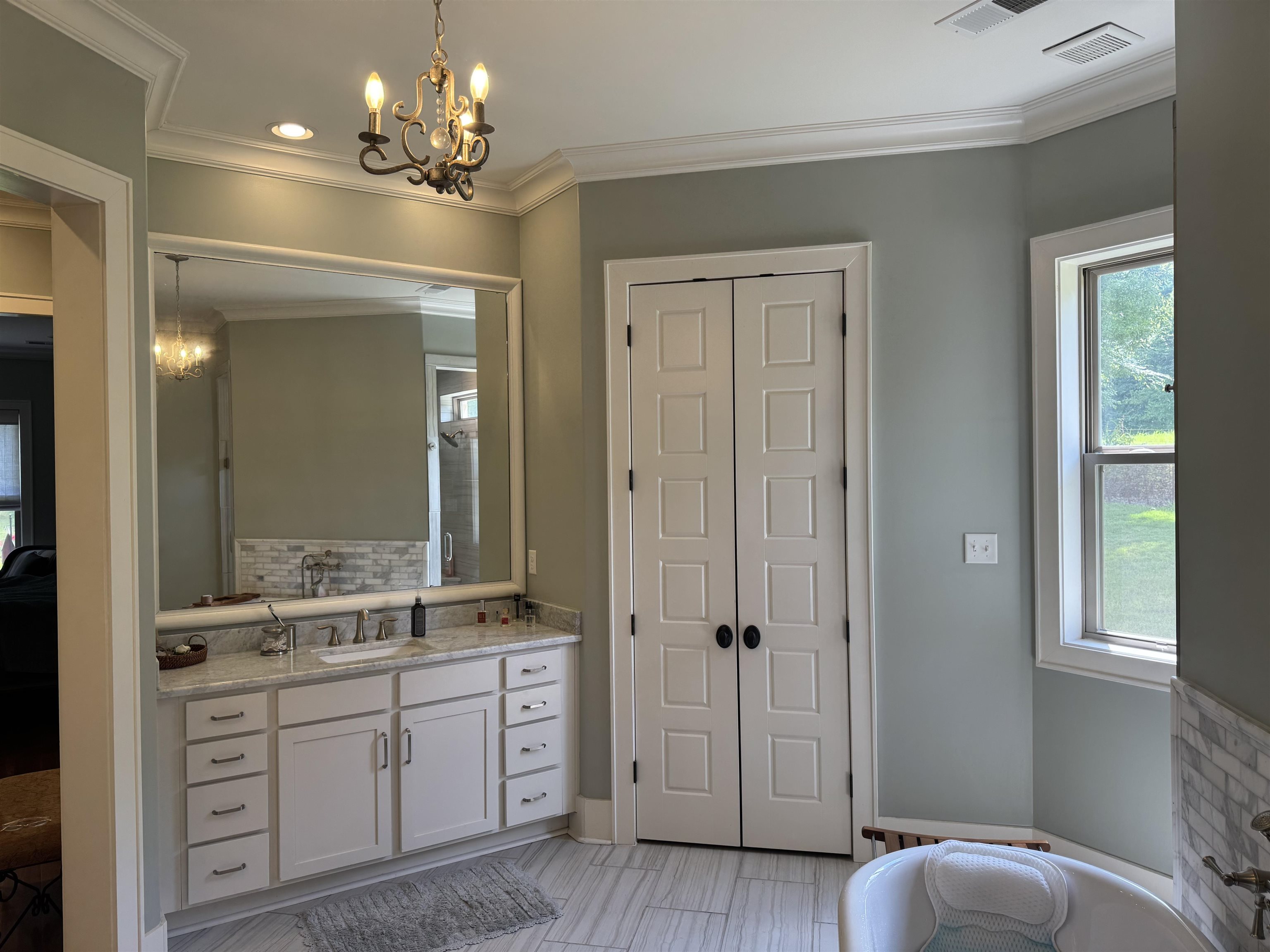 10879 Latting Road Eads, TN 38028 - Photo 36 of 40 a spacious bathroom with a granite countertop sink a toilet and a mirror