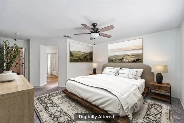 an empty room with closet and a ceiling fan