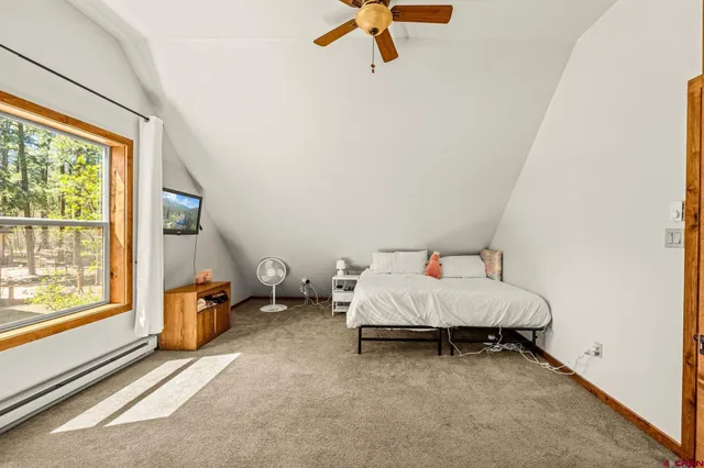 a bed room with a bed and a window