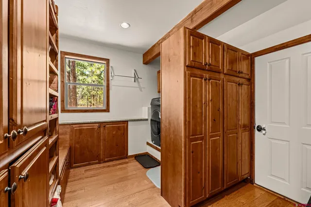 a view of a refrigerator in kitchen and wooden floor