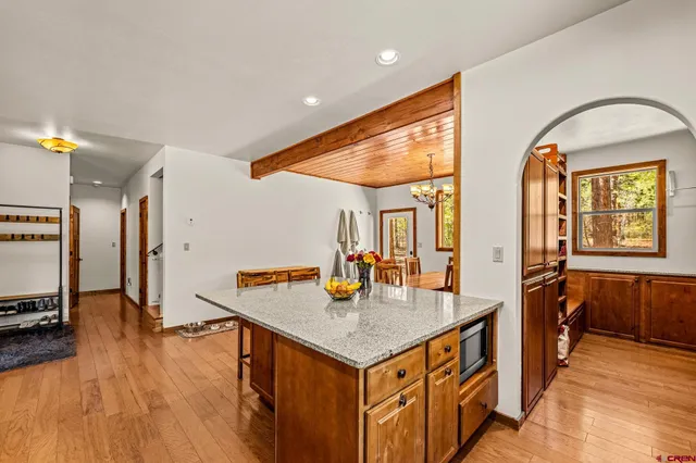 a kitchen that has a table and chairs in it