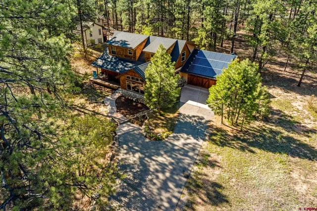 a backyard of a house with barbeque oven