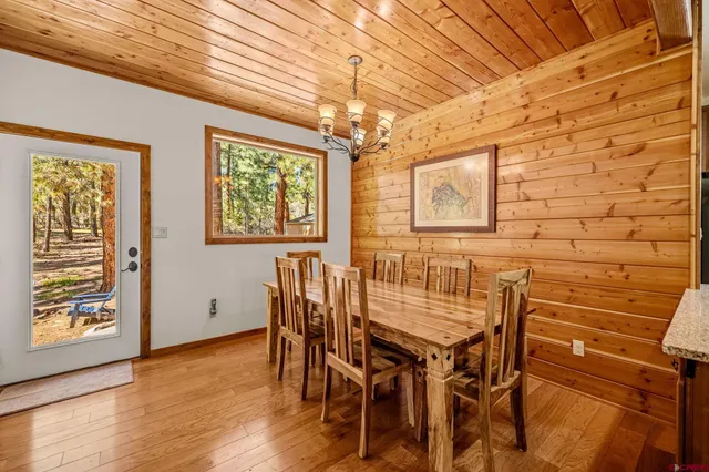 a view of a dining room with furniture and window