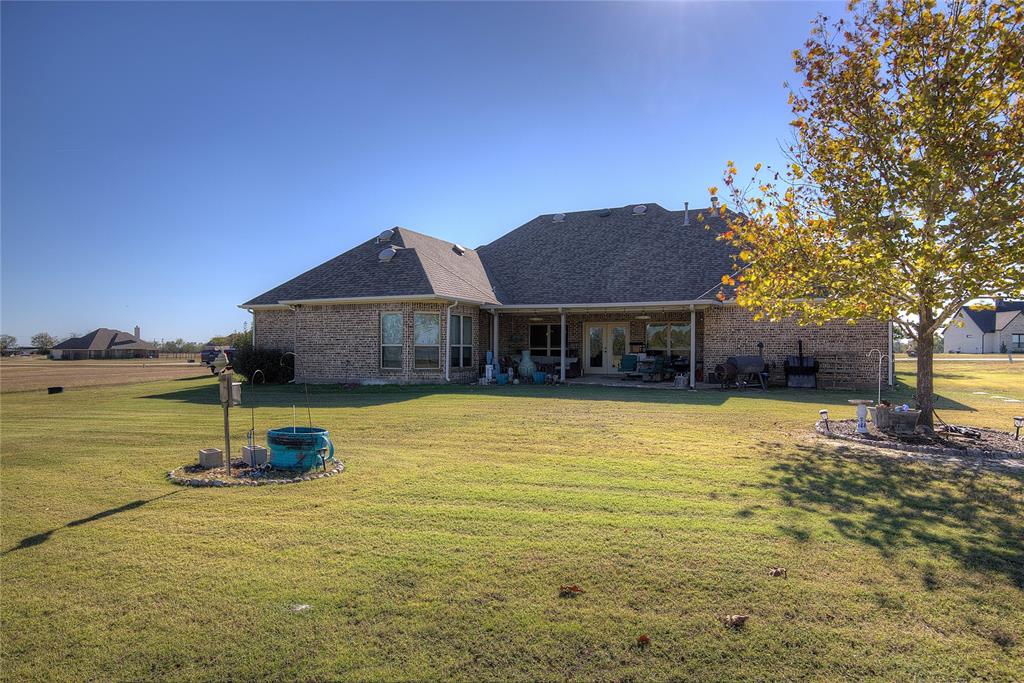 1066 Canyon Lake Road Wills Point, TX 75169 - Photo 30 of 40 a house view with a swimming pool and wooden fence
