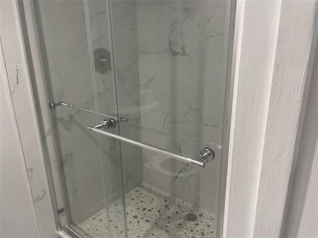 1721 Whitehall Drive, Unit 404 Davie, FL 33324 - Photo 9 of 16 a bathroom with a shower