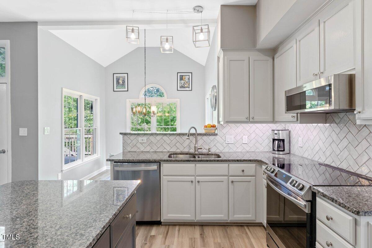 1103 Pearson Farms Road Apex, NC 27502 - Photo 15 of 58 Gorgeous tiled backsplash!