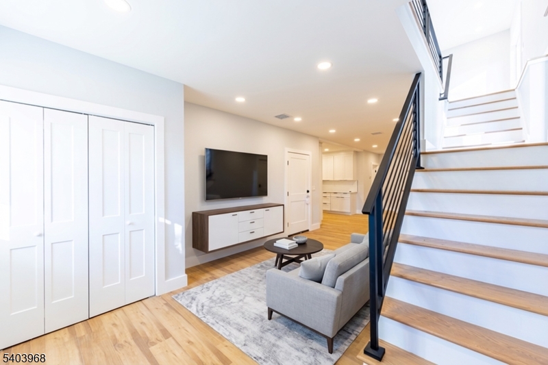 24 Bertrand Island Road Mount Arlington, NJ 07856 - Photo 11 of 44 a living room with furniture and a flat screen tv