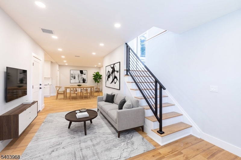24 Bertrand Island Road Mount Arlington, NJ 07856 - Photo 13 of 44 a living room with furniture and a flat screen tv