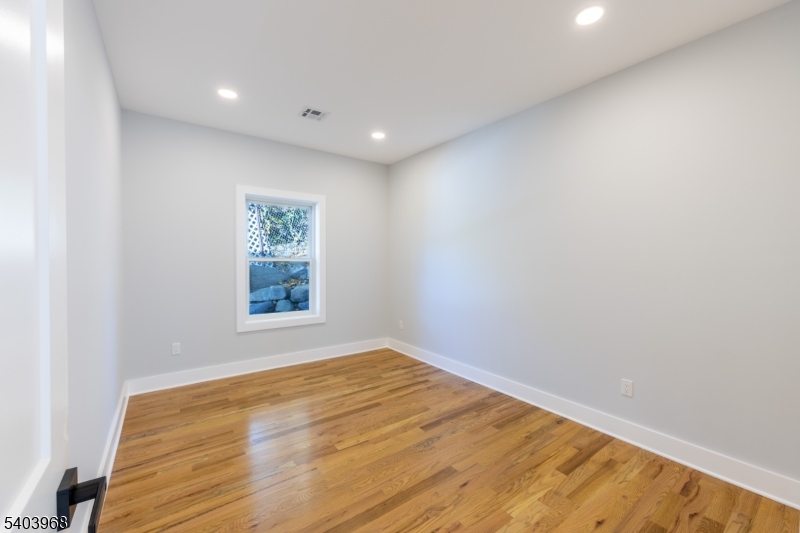 24 Bertrand Island Road Mount Arlington, NJ 07856 - Photo 19 of 44 a view of empty room with wooden floor