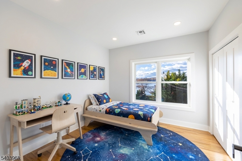 24 Bertrand Island Road Mount Arlington, NJ 07856 - Photo 26 of 44 a bedroom with furniture and a window