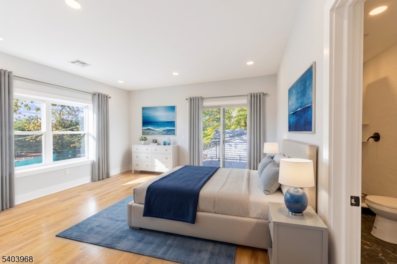 24 Bertrand Island Road Mount Arlington, NJ 07856 - Photo 29 of 44 a bedroom with a bed and window