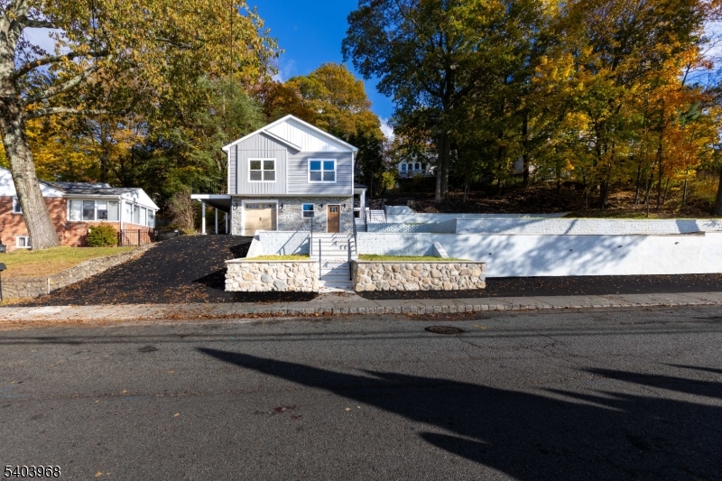 24 Bertrand Island Road Mount Arlington, NJ 07856 - Photo 3 of 44 a front view of a house with garden