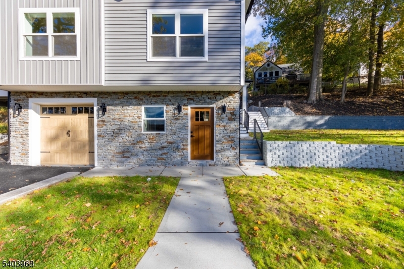 24 Bertrand Island Road Mount Arlington, NJ 07856 - Photo 5 of 44 a front view of a house with a swimming pool