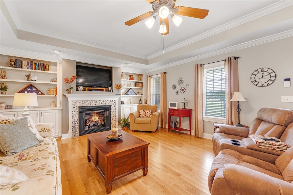 379 Hooper Road Winchester, TN 37398 - Photo 11 of 52 a living room with furniture a flat screen tv and a fireplace