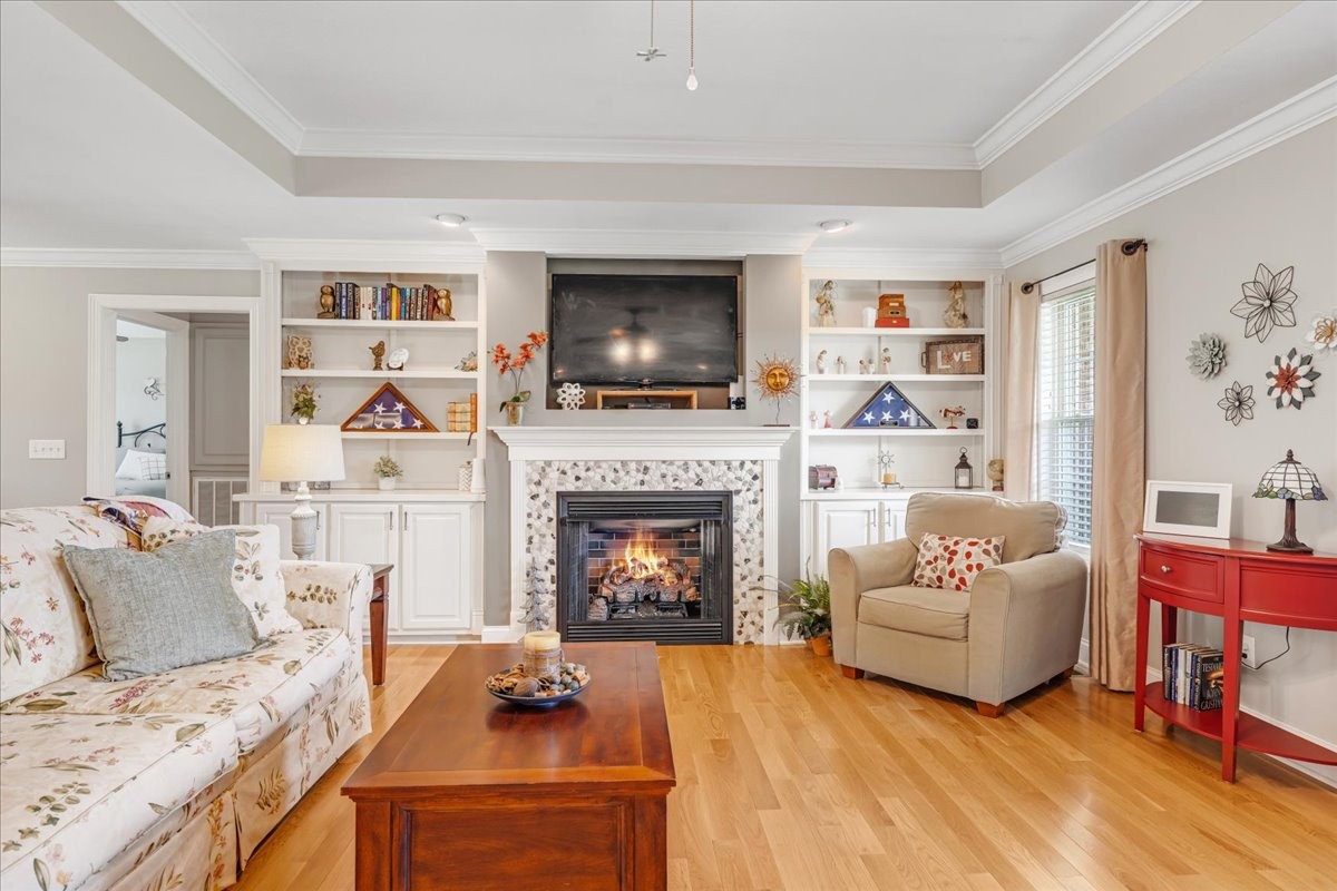 379 Hooper Road Winchester, TN 37398 - Photo 12 of 52 a living room with furniture a flat screen tv and a fireplace