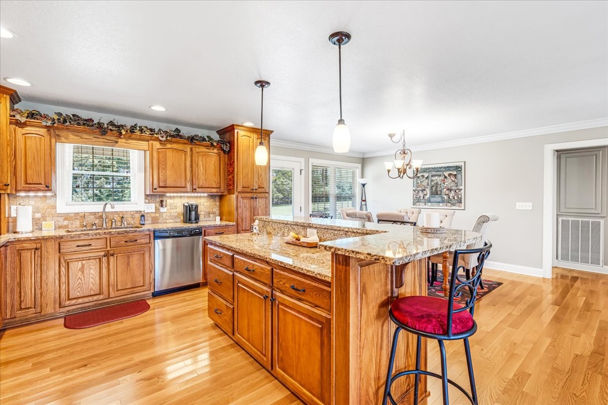 379 Hooper Road Winchester, TN 37398 - Photo 16 of 52 a kitchen with stainless steel appliances granite countertop a stove and refrigerator