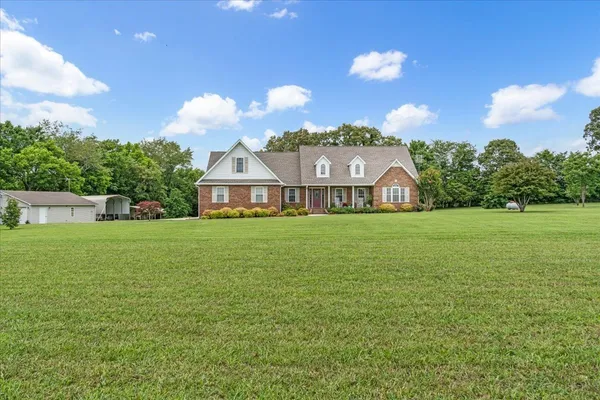 a view of a house with a big yard
