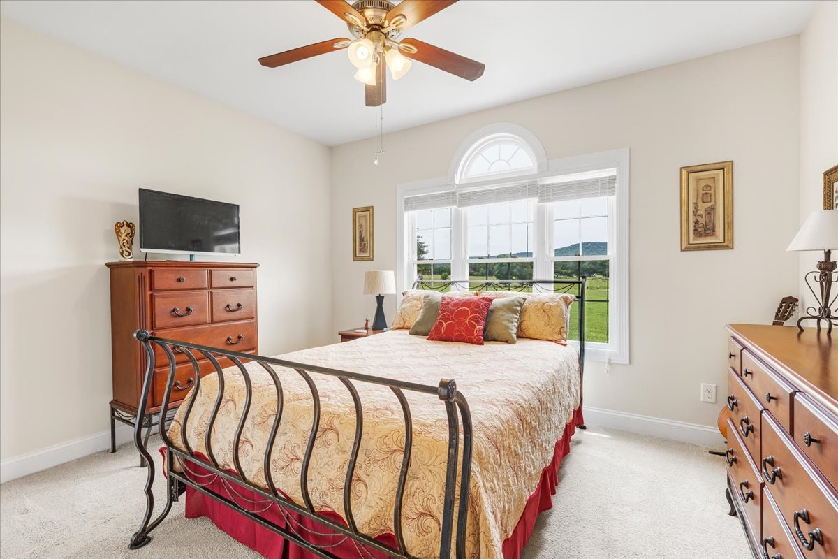 379 Hooper Road Winchester, TN 37398 - Photo 26 of 52 a bedroom with a bed and a flat tv screen on dresser