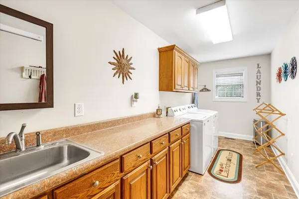 a bathroom with a sink mirror and a bathtub