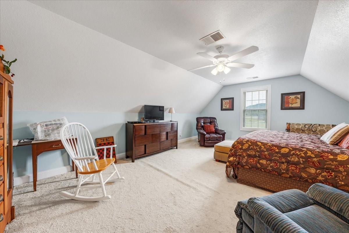 379 Hooper Road Winchester, TN 37398 - Photo 35 of 52 a bedroom with furniture and a chandelier