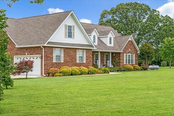 a front view of a house with a yard