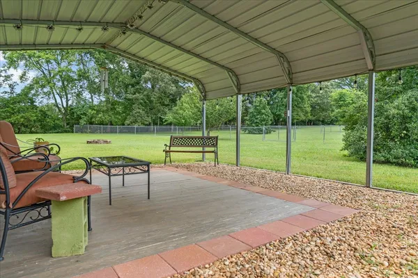 a view of a swimming pool with a yard