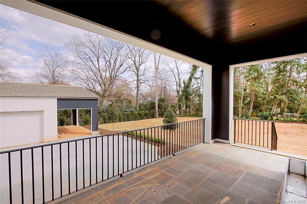 3935 Abingdon Road Charlotte, NC 28211 - Photo 11 of 23 a view of a porch with wooden floor and fence