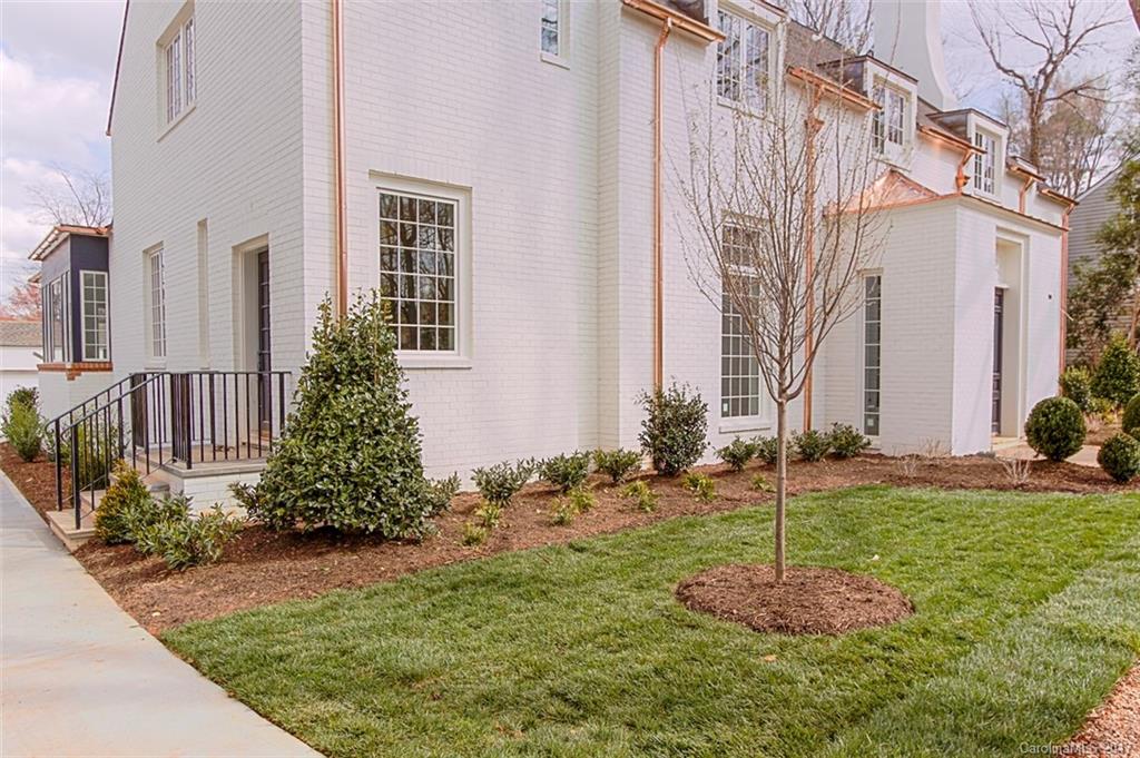 3935 Abingdon Road Charlotte, NC 28211 - Photo 2 of 23 a front view of a house with garden