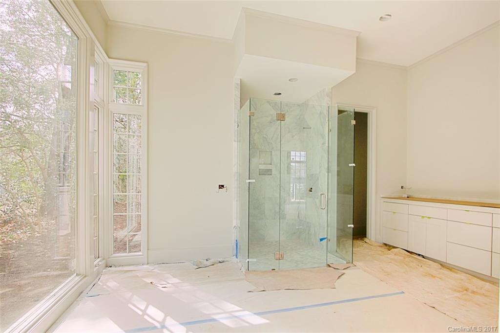 3935 Abingdon Road Charlotte, NC 28211 - Photo 21 of 23 a view of a bathroom with a shower and a tub