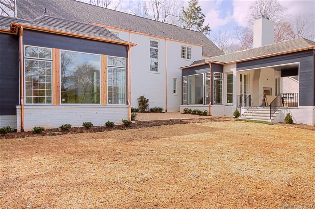 3935 Abingdon Road Charlotte, NC 28211 - Photo 6 of 23 a view of a brick house with large windows