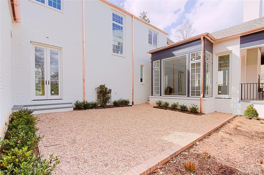 3935 Abingdon Road Charlotte, NC 28211 - Photo 7 of 23 a view of a house with potted plants